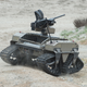 A unmanned vehicle, part of the Multi-Utility Tactical Transport (MUTT) family of systems, operates on Red Beach during the Ship-to-Shore Maneuver Exploration and Experimentation (S2ME2) Advanced Naval Technology Exercise (ANTX) 2017 at Marine Corps Base Camp Pendleton, California. (U.S. Navy photo by John F. Williams/Released)